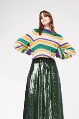 Falda midi de poliéster con lentejuelas verdes.