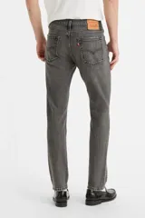 Pantalón de jean gris oscuro, corte skinny, tiro medio y confeccionado en tejido rígido.