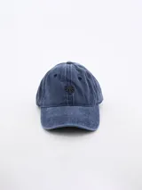 Gorro de béisbol azul denim con logo de palmera bordado en negro.