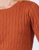 Buzo de punto marca Tahari con diseño de ochos verticales, cuello a la base y manga corta en color marrón.