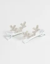 Set de dos hebillas plateadas para el pelo con forma de cuernos de reno y apliques de strass.