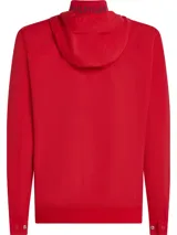 Campera roja con capucha, cierre frontal con cremallera, cuello alto y dos bolsillos laterales. Logo de Tommy Hilfiger bordado en la manga.