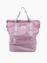 Bolso de viaje plegable color verde agua, con base gris y cierre superior.