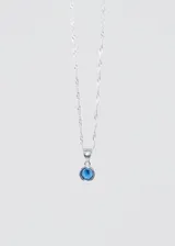 Collar de plata 925 con dije de punto de luz con zirconia azul engarzada.