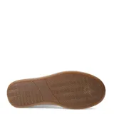 Zapatillas deportivas blancas con cordones, detalle de animal print en el talón y suela gruesa color caramelo.