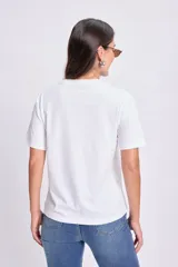 Remera blanca de algodón con estampa amarilla con el texto "Limoncello".