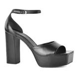 Sandalias de vestir negras con plataforma y taco cuadrado alto. Tira delgada con hebilla alrededor del tobillo. Marca Marco Donatti.