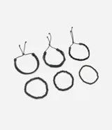 Set de seis pulseras negras para hombre, que incluyen tres pulseras trenzadas con ajuste corredizo y tres pulseras de cuentas con elástico.