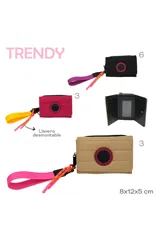 Billetera Trendy color beige con cierre de velcro, detalle de logo circular y cinta de agarre amarilla.