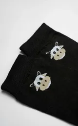 Medias negras con diseño de vaca.
