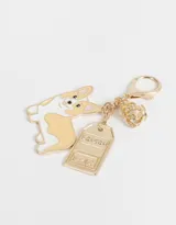 Llavero dorado con dije de perrito corgi, corona y placa con la palabra "London".