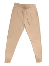 Pantalón de jogging color beige, de corte babucha, con cintura y tobillos elastizados y cordón ajustable.