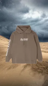 Buzo hoodie marrón con estampado en la espalda de una flor con un ojo en el centro y texto en la parte inferior.