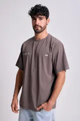Remera manga corta oversize color gris con estampa Culture en el frente.