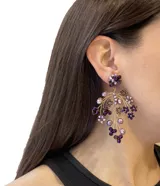 Caravanas de diseño exclusivo, hechas a mano, con cuentas en tonos violetas y ajuste clip de acero inoxidable.