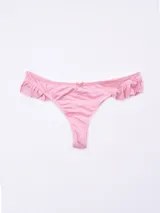 Colaless rosado de tejido acanalado, con detalle de lazo pequeño en el centro frontal y volados de tela en los laterales.