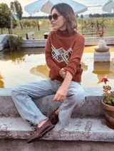 Mocasines náuticos color borgoña de cuero con cordones y suela marrón.