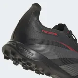 Championes de fútbol Adidas Predator League Turf, color negro con detalles en gris y rojo. Diseñados para césped artificial, con parte superior Hybridfeel con textura 3D y aletas Strikescale para control del balón.