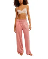 Pantalón de jogging color salmón, con cintura elástica, dos bolsillos y largo hasta los tobillos.