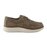 Zapato náutico azul de lona con cordones y suela blanca.