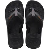 Ojotas Havaianas Track Plus, color negro con tiras grises y detalles en naranja.