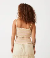 Blusa cropped de tirantes color crema con rayas horizontales rosas y naranjas, con elástico en el escote y en el bajo.