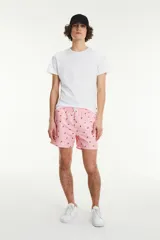 Short de baño rosado con estampado de sandías, cintura elástica con cordón ajustable y bolsillos laterales.