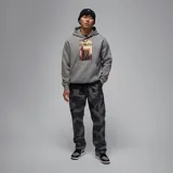 Pantalón de corte recto con estampado de camuflaje en tonos grises y negros, con cintura elástica y bolsillos laterales.