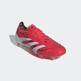 Championes de fútbol Adidas Predator Elite color rojo con detalles en blanco y suela transparente con tapones.