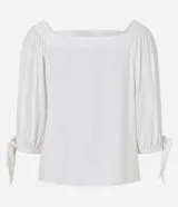 Blusa de mangas 3/4 con elásticos y lazos en los puños, confeccionada en viscosa, con escote cuadrado.