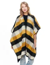 Ruana de tejido soft, color rosa pálido, celeste, gris y beige, con diseño a cuadros. Presenta terminación en zig zag con lana en los bordes y sisa amplia.