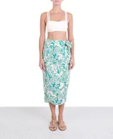 Falda midi de tiro alto con estampado floral en tonos turquesa y blanco, con lazo lateral.