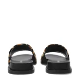 Sandalias Bottero negras con banda ancha de pelo sintético.