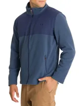 Campera polar RKF modelo Dover, de poliéster reciclado, color azul con canesú de tela canvas de algodón. Tiene cuello alto, cierre completo, dos bolsillos frontales con cierre y forro de jersey.