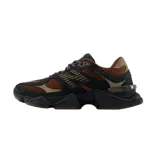 Championes urbanos New Balance modelo 9060, color marrón y negro, confeccionados en gamuza y malla, con logo "N" característico en los laterales y entresuela ABZORB.