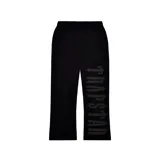 Pantalón de jogging negro con cordón ajustable en la cintura y logo "Trapstar" estampado en gris en la pierna derecha.