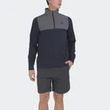 Buzo deportivo Le Coq Sportif de manga larga, con cuello alto y cierre parcial frontal. Presenta un diseño de bloques de color: la parte superior del pecho y el cuello son de color gris, mientras que el resto del cuerpo y las mangas son de color azul marino. Lleva el logo de la marca bordado en el pecho.