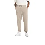 Pantalón de jogging color beige, con cintura elástica ajustable con cordón, bolsillos laterales y logo de la marca bordado en la pierna izquierda.