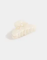 Broche para el pelo color crema con forma de pinza y detalle de moño.
