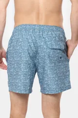 Short de baño azul con estampado de hojas, cintura elástica con cordón ajustable, dos bolsillos laterales y suspensor de malla fina.