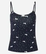 Musculosa de pijama confeccionada en microfibra color negro con estampa de lunares y perritos blancos. Tiene breteles finos fijos y picueta en el escote.