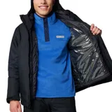 Campera Columbia Whirlibird V para hombre, color negro. Sistema Interchange 3 en 1 con capa exterior impermeable y capa interior aislante. Costuras selladas Omni-Tech™, forro termorreflectante Omni-Heat™ y aislamiento Thermator™ 100 % poliéster reciclado. Capucha ajustable, ventilación en las axilas, faldón para nieve, múltiples bolsillos y dobladillo ajustable con cordón.