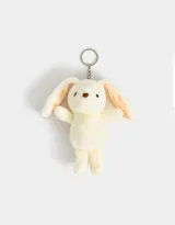 Llavero con dije de conejo de peluche color crema con orejas largas y detalles bordados en marrón. Incluye aro y mosquetón metálico plateado.