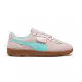 Championes Puma Palermo negros con detalles en blanco y suela color caramelo.