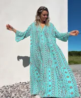 Vestido túnica largo color celeste con estampado de motivos geométricos en color ladrillo.