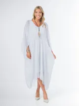 Vestido túnica blanco de seda italiana con frunce, calce oversized y talle único. Lleva forro elastizado al tono.