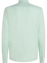 Camisa Tommy Hilfiger de hombre, modelo 1985, de corte regular, confeccionada en algodón orgánico Oxford con diseño de cuadros Vichy en tonos verde y blanco. Presenta cuello abotonado, puños redondeados con doble botón y logo bordado en el pecho.