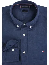 Camisa de vestir azul de lino, con cuello abotonado, corte slim y logo de Tommy Hilfiger bordado en el pecho.