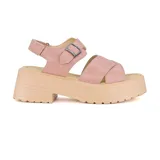 Sandalia de plataforma en color rosa, con tiras cruzadas y ajuste en el tobillo.