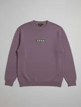 Sweater azul con logo de la marca Rusty bordado en el pecho.